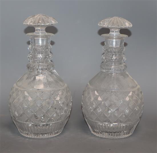 A pair of cut glass mallet decanters height 25cm